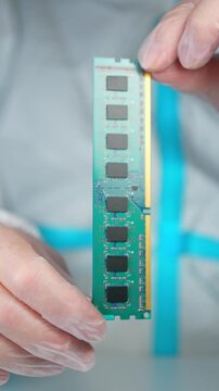 RAM stick with DRAM, Dynamic Random Access Memory chips. Core storage components holds data temporarily for quick CPU access. Storage of binary information using billions of capacitors and transistors