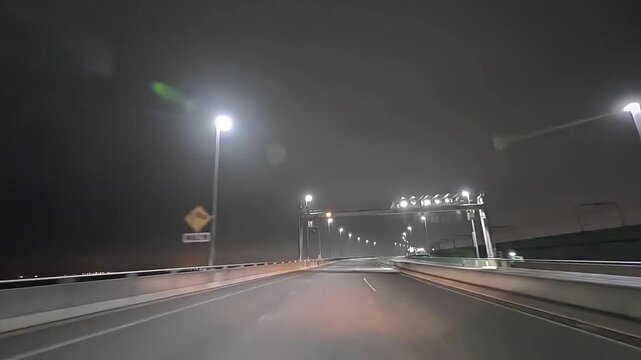 セントレアライン　中部国際空港連絡道路　愛知県　日本　移動映像　りんくう本線料金所　夜間