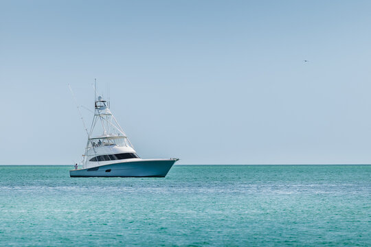 Offshore saltwater sport fishing boat on a sunny summer day. Fisherman on large powerboat on the Gulf of America, Florida.