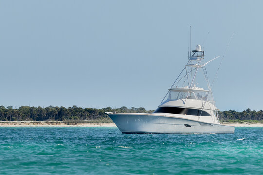 Offshore saltwater sport fishing boat on a sunny summer day. Fisherman on large powerboat on the Gulf of America, Florida.