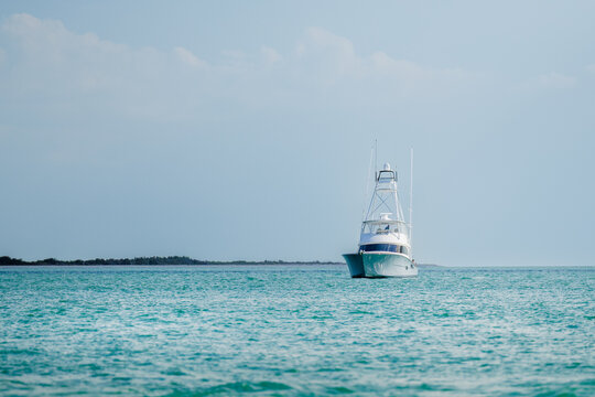 Offshore saltwater sport fishing boat on a sunny summer day. Fisherman on large powerboat on the Gulf of America, Florida.