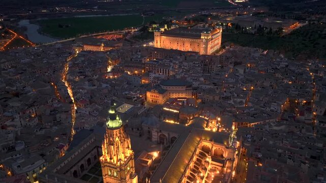 Aerial night view of the historic Toledo, Illuminated medieval city with Alcazar of Toledo Castilla-La Mancha, Spain.
