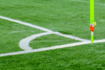 soccer field with green grass, white markings, and a corner flag.. The image captures part of the pitch used in professional matches, highlighting sports atmosphere and game preparation © Point of view