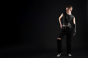 Fototapeta premium Young man in stylish clothes and accessories on black background, space for text