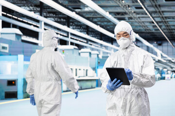 QC engineer inspecting semiconductor production infrastructure, optimizing photolithography process. Scientist doing RD on silicon wafers in research facility, trialing advanced materials