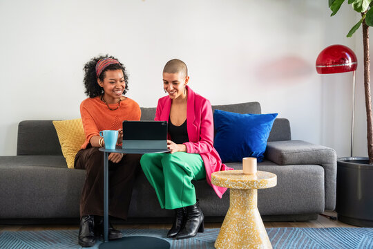 Women creatively collaborating in a modern business setting