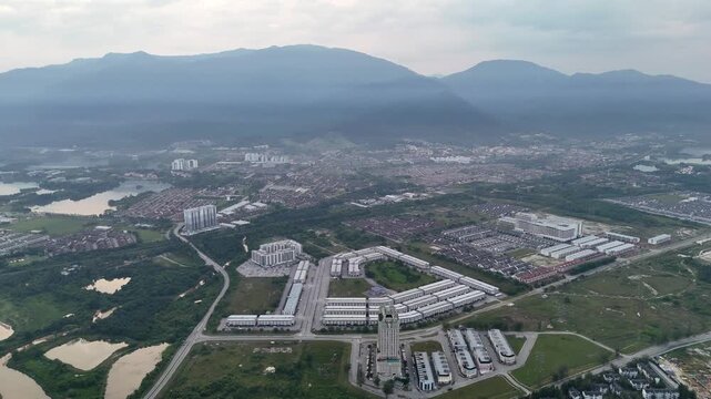 Aerial view captures Kampar Barat with its mix of urban development and surrounding greenery.