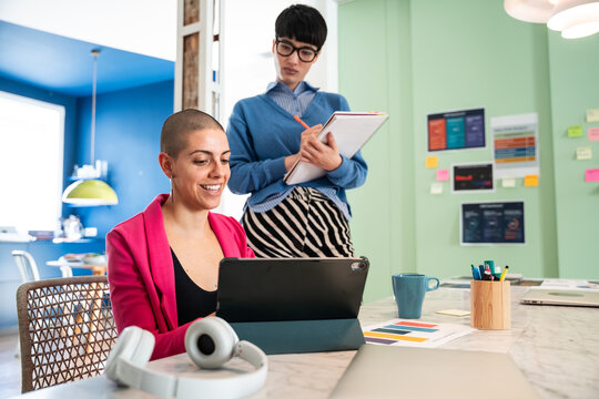 Women collaborating in creative business setting