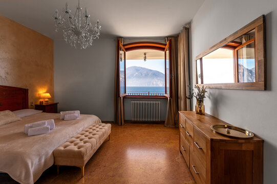 Luxury Italian lakeside villa bedroom with mountain view