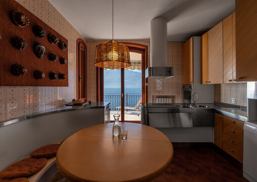 Luxury Italian lakeside villa kitchen with balcony view