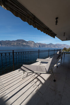 Luxury lakeside villa terrace in Italy with mountain view