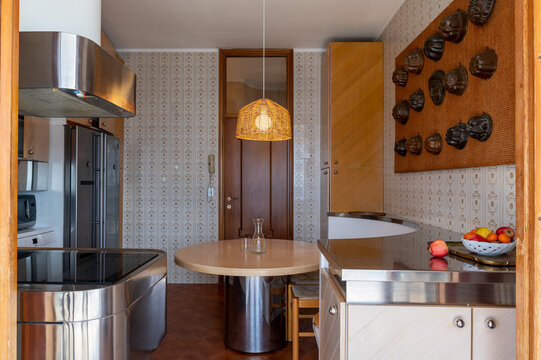 Retro kitchen interior with round table and pendant light