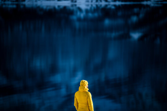 Lone traveler in Tromso Norway with blurred fjord backdrop