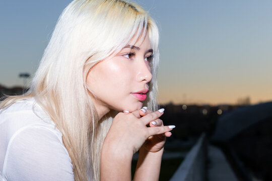 Gen Z Urban lifestyle portrait with flash and platinum hair