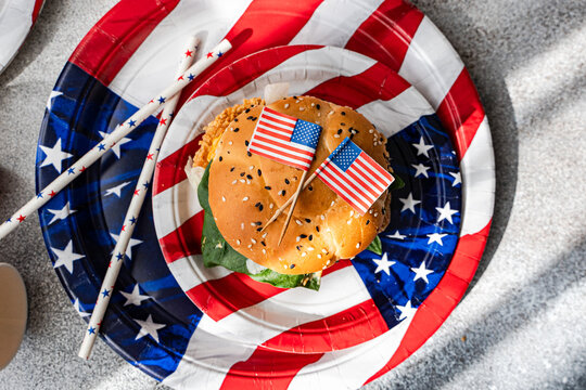 American flag burger on party plates for Independence Day