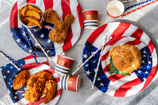 USA Independence Day party food with burger and wings