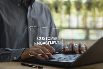 Businessman using laptop with customer engagement interface, digital marketing strategy, CRM...