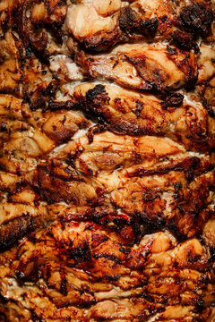 Kebab style grilled chicken meat texture with layered juicy slices
Shawarma meat texture close up with roasted chicken layers
Gyros style chicken meat background with crispy grilled surface
