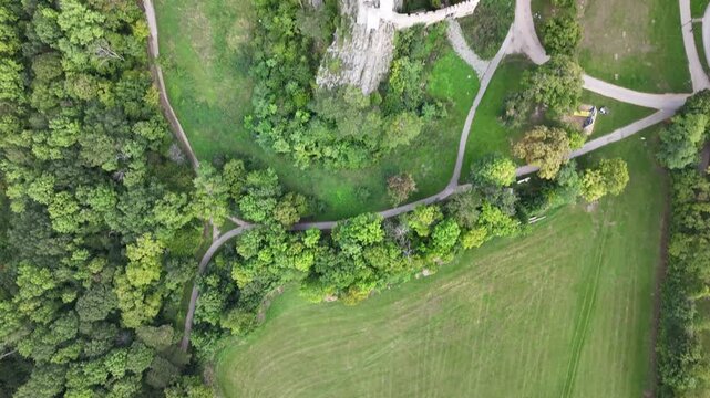 Top down drone view of Burg Lichtenstein castle and surrounding terrain.