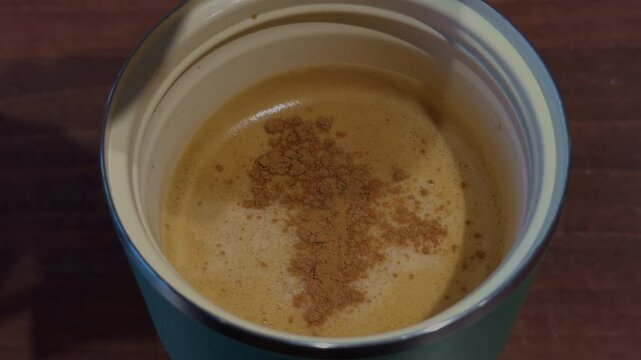 Closeup of creamy foam surface within mug showcasing microfoam and rich textures
