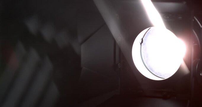 Stage Light Drama. Darkened Stage Is Bathed In High Contrast Beam Revealing Dust And Reflective Surfaces