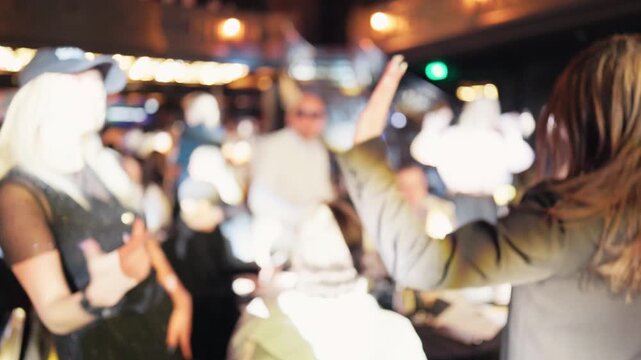 Capturing vibrant energy of celebrating party under colorful stage illumination