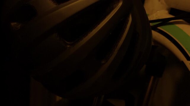 Vivid neon safety headgear. Closeup of bright neon bicycle helmet detail