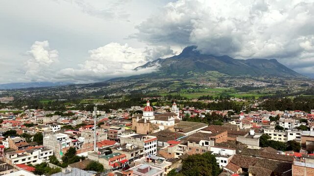 Cinematic Aerial View of Cotacachi with Central Cathedral and Andean Landscape