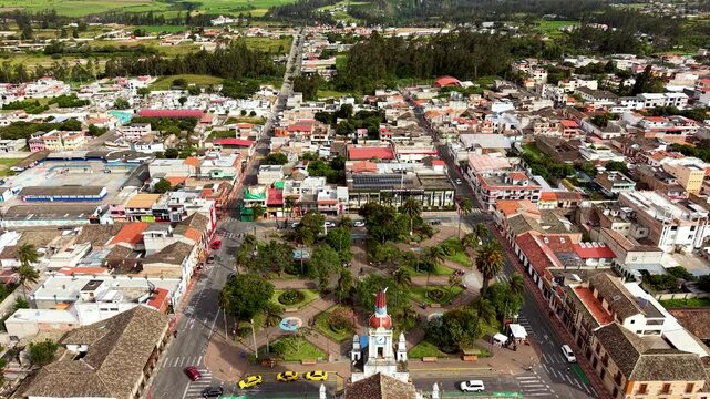 Cinematic Aerial View of Cotacachi with Central Cathedral and Andean Landscape