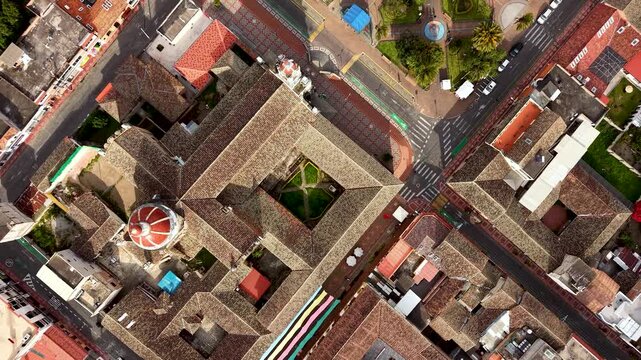 Cinematic Aerial View of Cotacachi with Central Cathedral and Andean Landscape