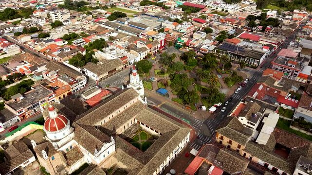 Cinematic Aerial View of Cotacachi with Central Cathedral and Andean Landscape