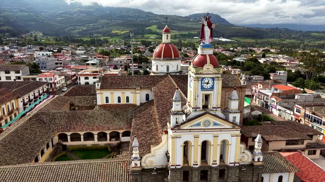 Cinematic Aerial View of Cotacachi with Central Cathedral and Andean Landscape