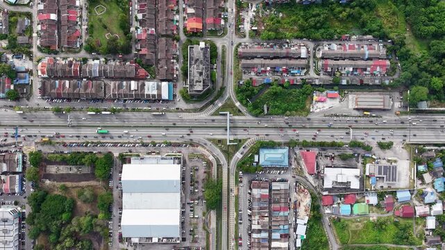 Drone perspective of Tampoi showing busy traffic flow on main roads.