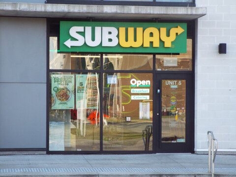 Ottawa, Ontario, Canada &ndash; July 25, 2025: A "Subway restaurant" storefront features its iconic green signage, promotional posters, a glass entrance, and a modern grey exterior wall at 770 Brookfield Rd