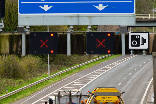 Road closed - RED X on a motorway gantry above two lanes indicating that traffic is prohibited from entering lane. 