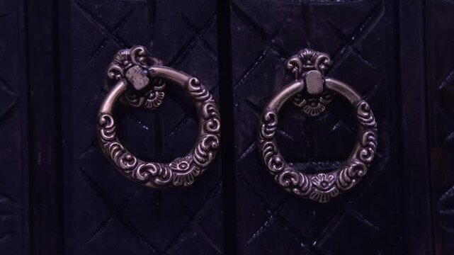 Elegant hands touch carved wooden wardrobe in Moroccan riad, emphasizing artisanal beauty and cultural heritage, Traditional Arabic home decor, exotic vintage decor, authentic experience