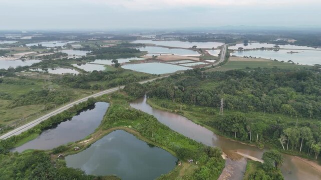 Aerial view highlights Kampar abandoned tin mines, relics of industrial past now reclaimed by nature.