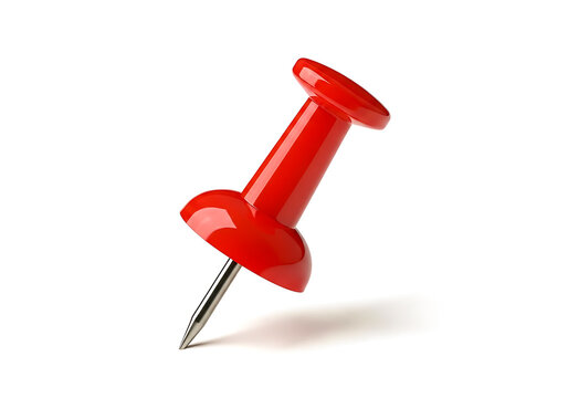Bright red pushpin standing upright on a flat surface isolated on white background
