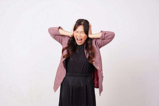 Frustrated asian woman screaming with hands on head