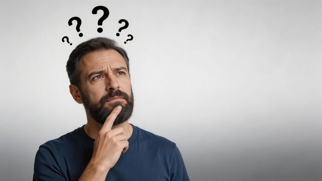 Man with question marks above his head