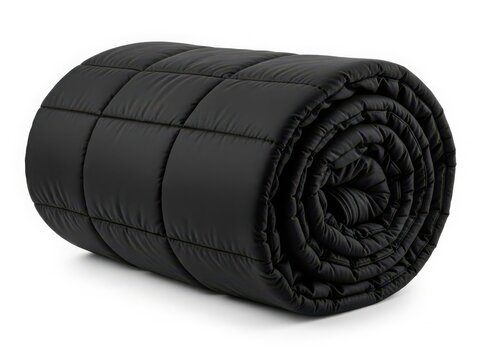 A thick, black, rolled-up mattress pad with a quilted pattern on a white background