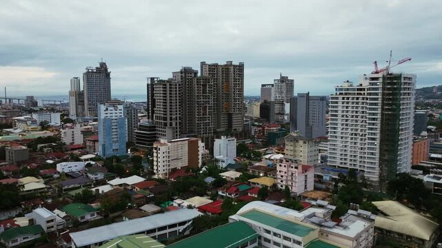 High rise buildings overshadow local homes, corporate dominance in Cebu City