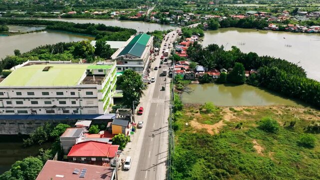 Cinematic view, Lingayen, Pangasinan, Philippines - bridge, cars, water channels