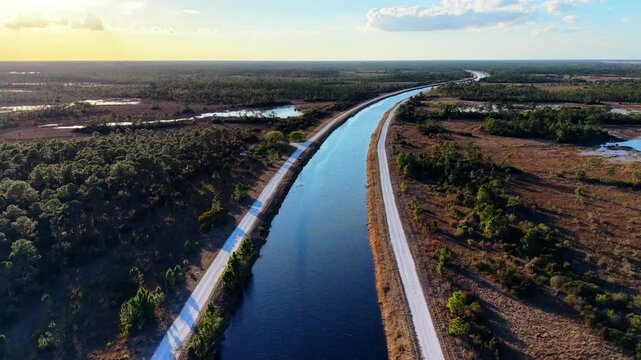 Drone flying over on of the canals in the John C. and Mariana Jones Hungryland Wildlife and Environmental Area showing the vast expanse of the area in Martin and Palm Beach County Florida