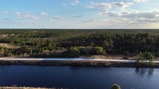 drone reveal shot at the John C. and Mariana Jones Hungryland Wildlife Environmental Area showing the vast expanse and diversity of the land including ponds, canals, lakes and prairies.