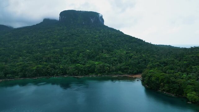 Aerial view of Pico Mesa Table mountain and Ba&iacute;a das Agulhas in cloudy Pr&iacute;ncipe
