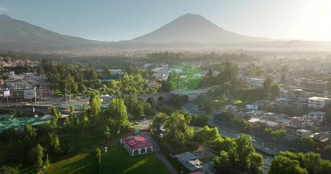 Sunset aerial view over Puente Grau Arequipa with Misti volcano on horizon