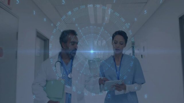 Doctor and nurse walking ward, nurse tapping tablet causing HUD showing patient records for care