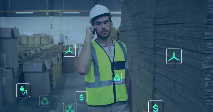 Walking man hardhat neon vest on phone near pallets in warehouse about sustainability, icons rising