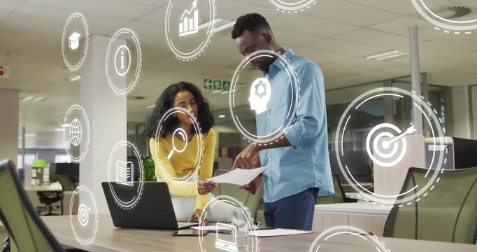 Woman handing page triggers man reading, tapping laptop for business while icons growing over faces